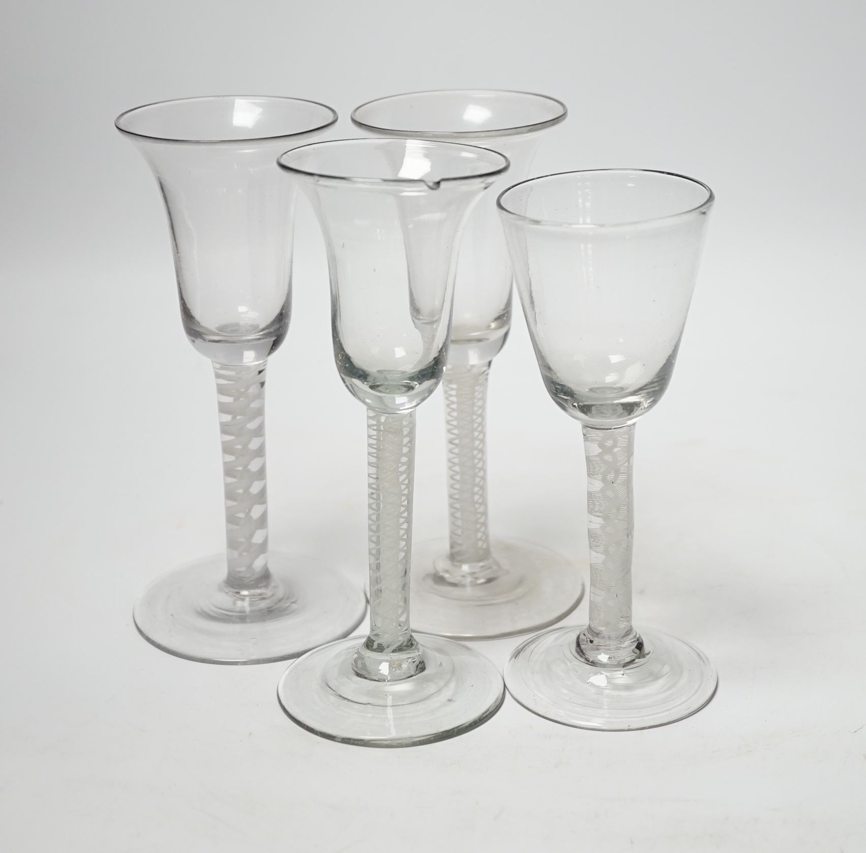 Four 18th century Dutch wine glasses with DSOT stems, three with bell-shaped bowls, one example with folded foot, tallest, 16.5cm